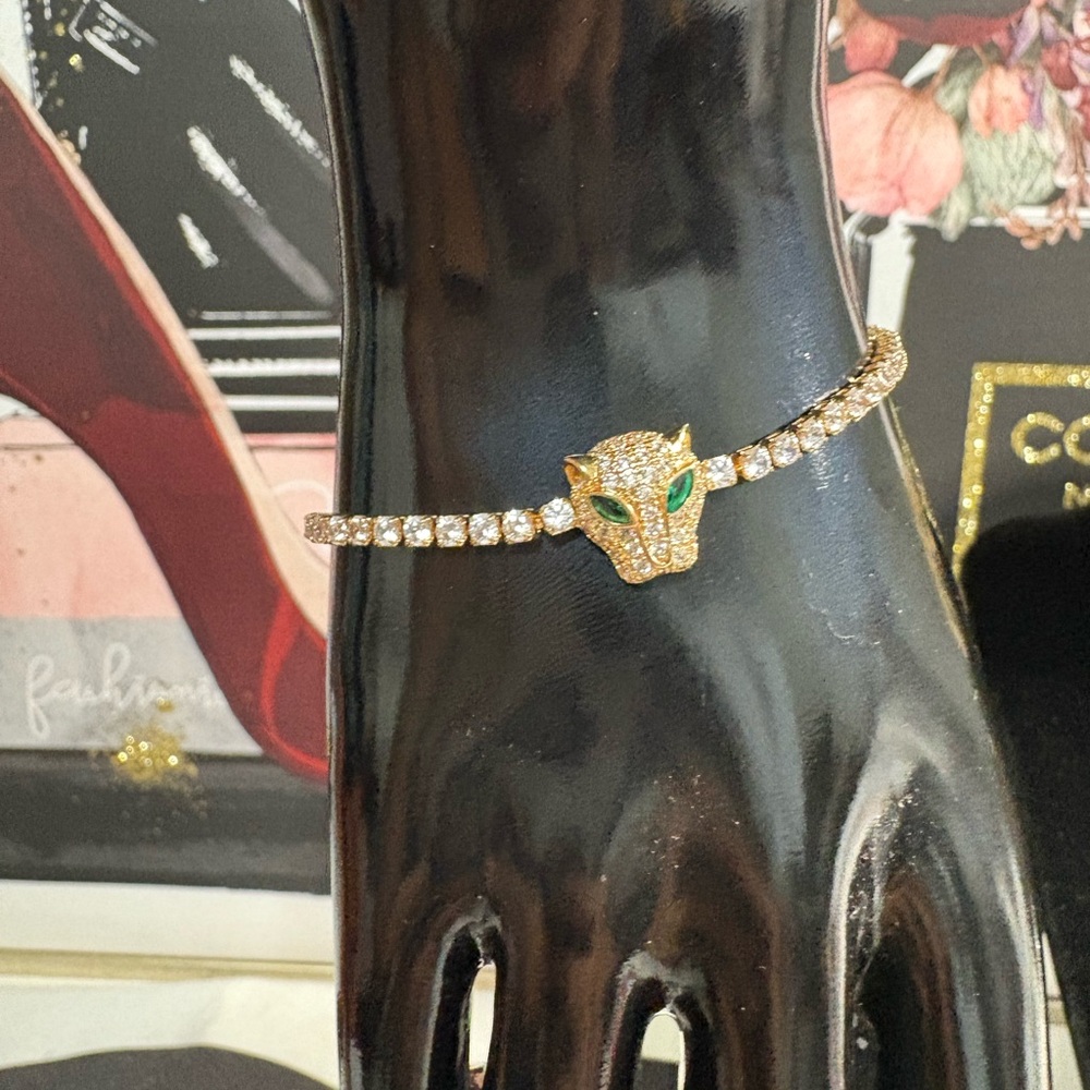 Elegant Gold Plated Panther Bracelet with Green Accents